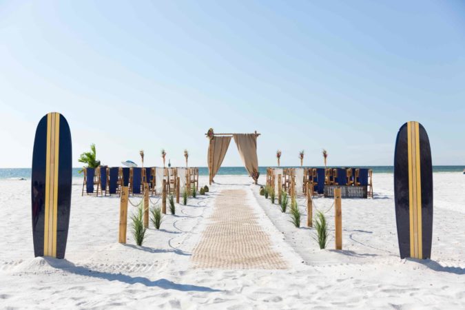 Luau-themed wedding on the beach