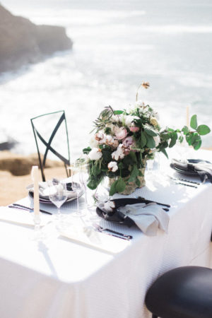 White Guest Table with Flower Centerpiece at a Beach Wedding