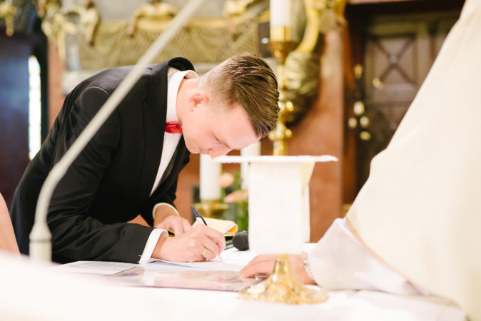 groom-signing-license