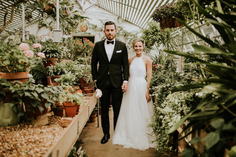 bride and groom with plants
