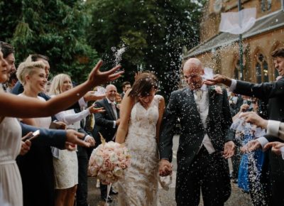 happy wedding procession, rice being thrown