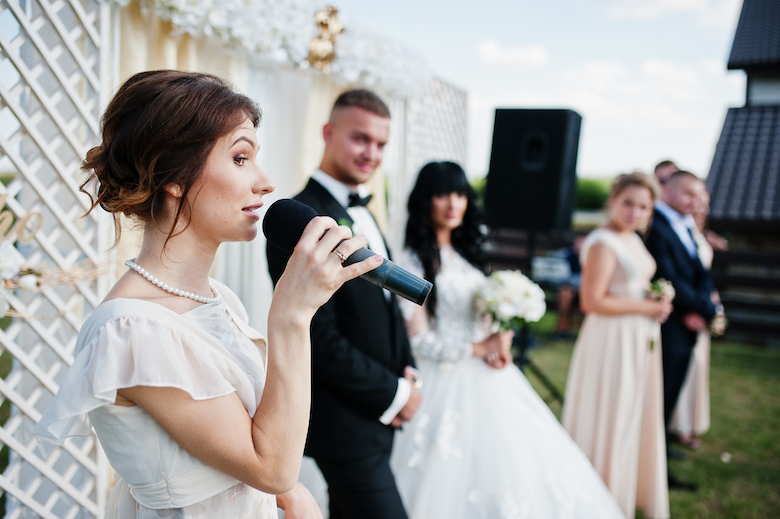 Woman giving a speech at a wedding