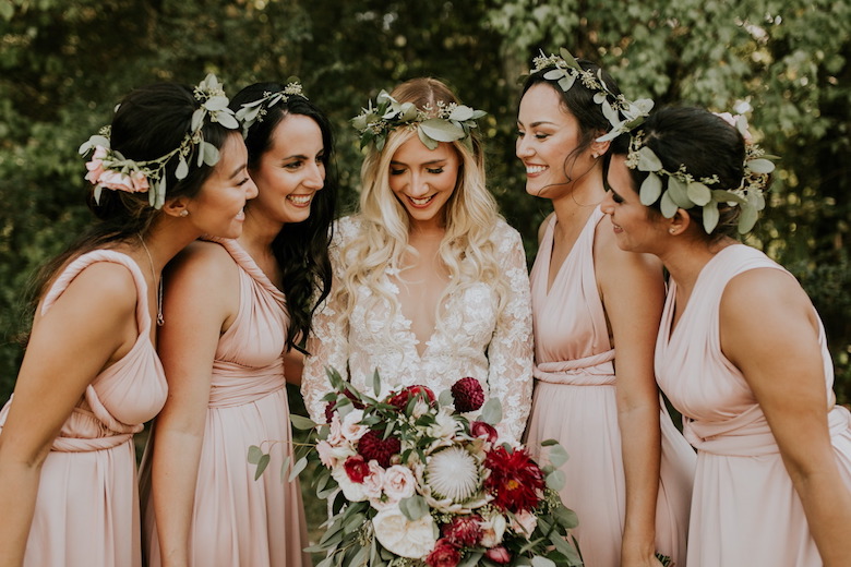 smiling bride with her bridesmaids