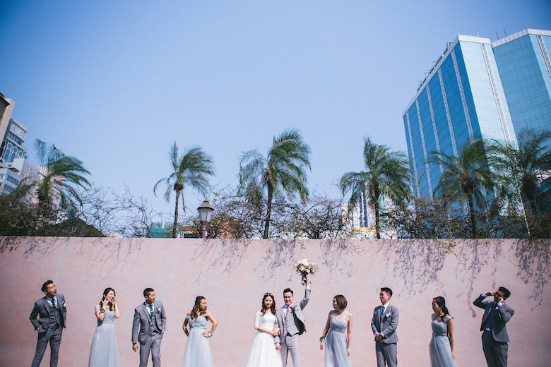 Happy bride & groom with their groomsmen and bridesmaids