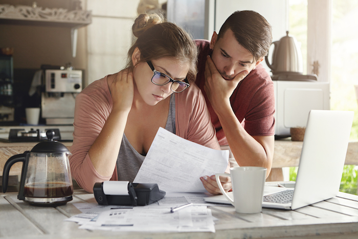 young couple looking over their finances