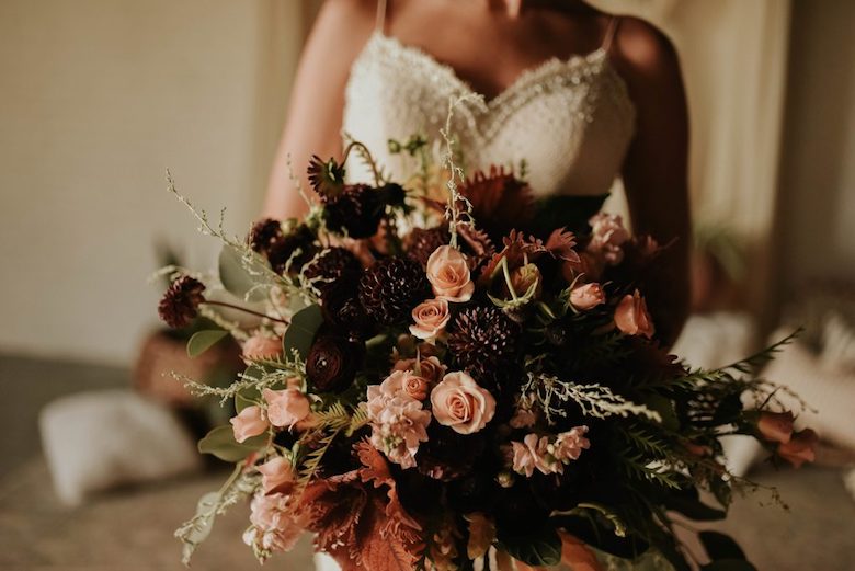 autumn bouquet, subtle colors, being held by the bride