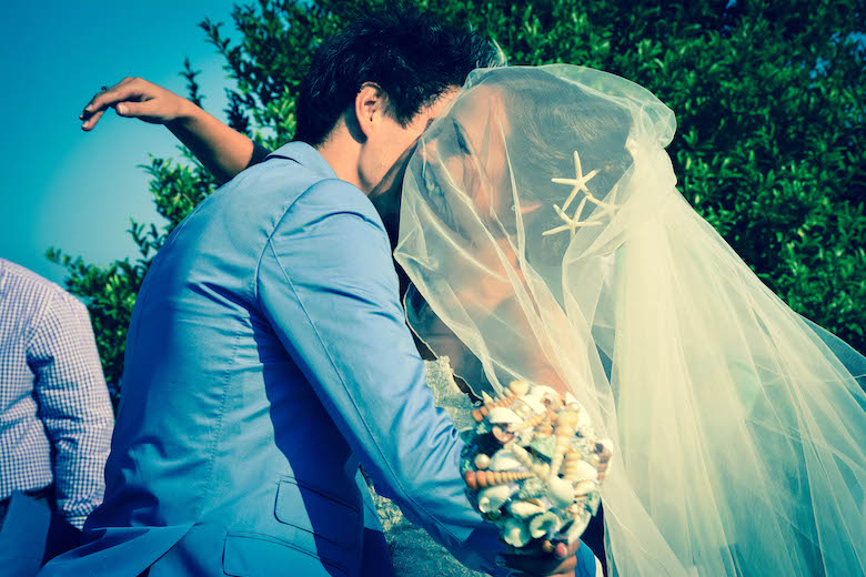 happy bride & groom enjoy a hug