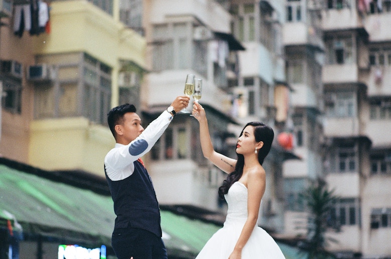 A bride and groom toast to their health and future fortune