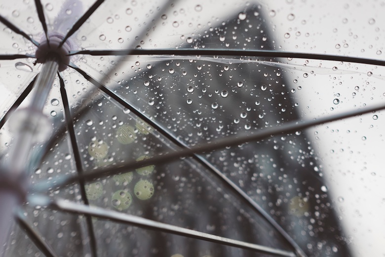 transparent umbrella with rain droplets