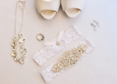 wedding jewelry (necklaces and rings), white backdrop