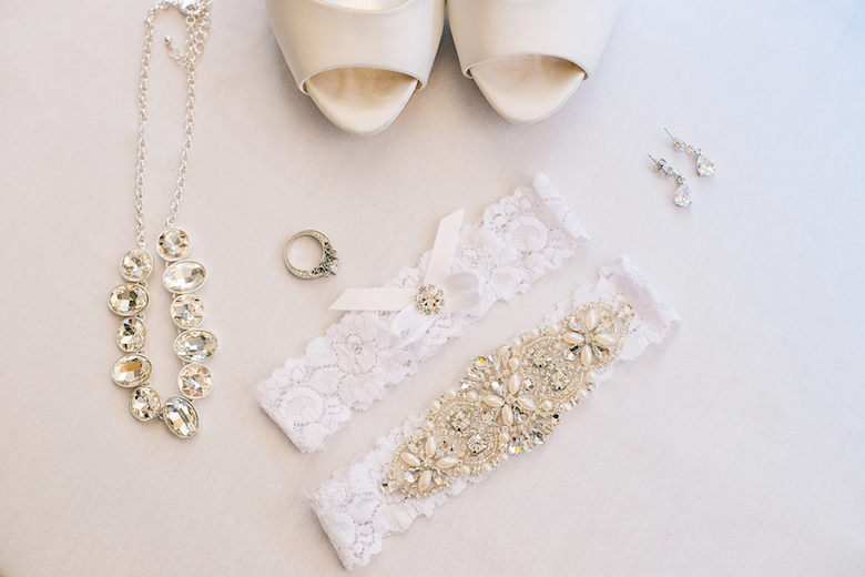 wedding jewelry (necklaces and rings), white backdrop