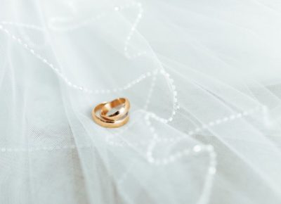 Wedding rings resting on veil