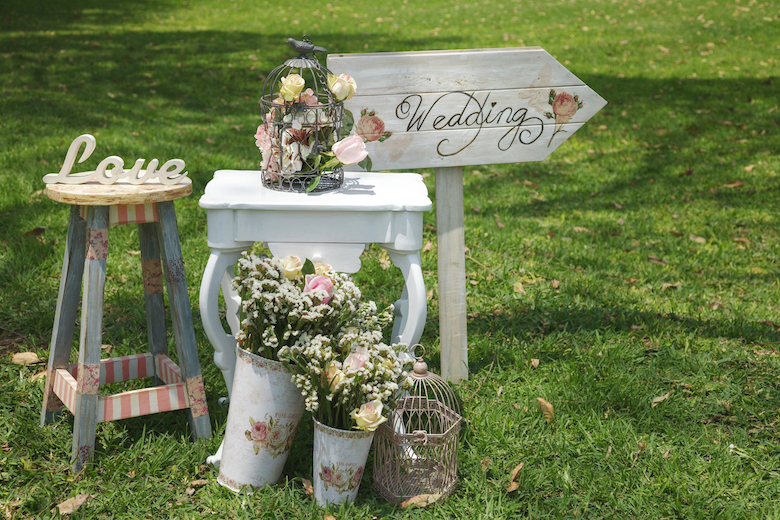 Wedding signs on a grassy lawn