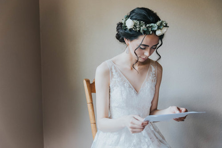 bride practicing her vows in a room alone