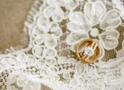 beautiful diamond wedding ring on a white silk tablecloth