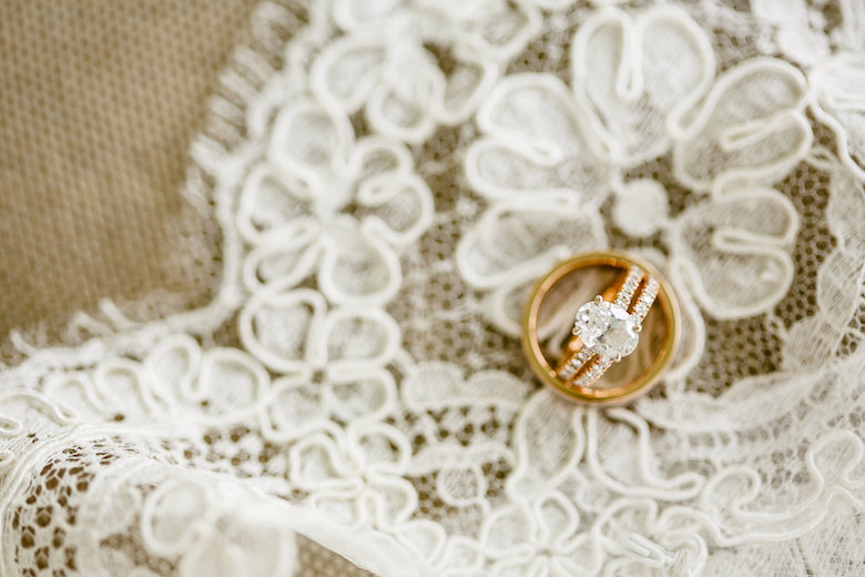 beautiful diamond wedding ring on a white silk tablecloth