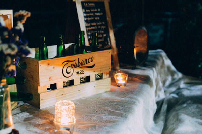 photo of Trabanco beer bottles, night-time at a wedding