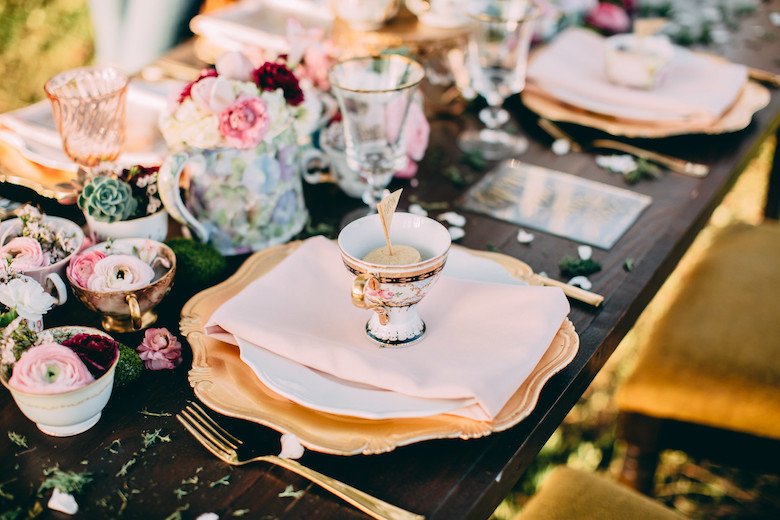 colorful table spread at a wedding ceremony, pinks and floral colors