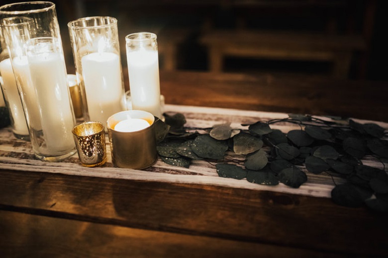 clear glass gold tinted votives with small candles for a vintage wedding centerpiece
