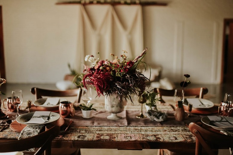 wild flowers in a rustic vase as a vintage wedding centerpiece