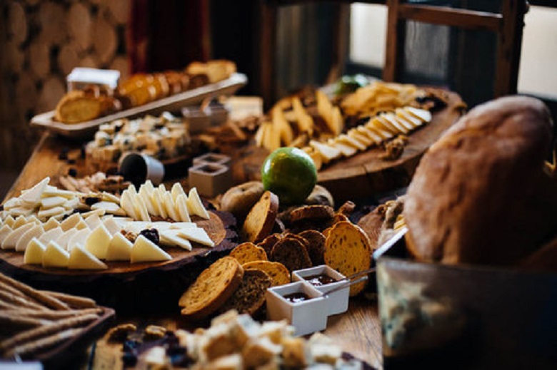 grazing table with assorted cheese and bread