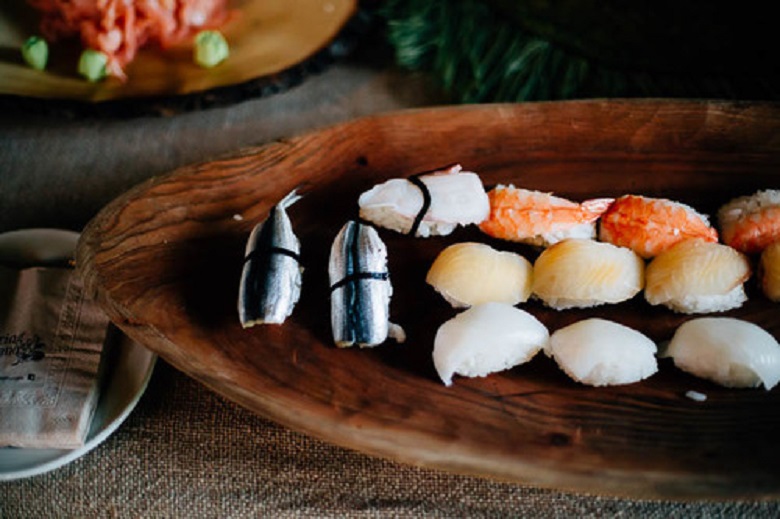 sushi on a wooden platter