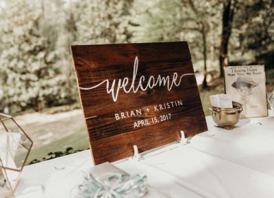 wooden handwritten wedding welcome sign