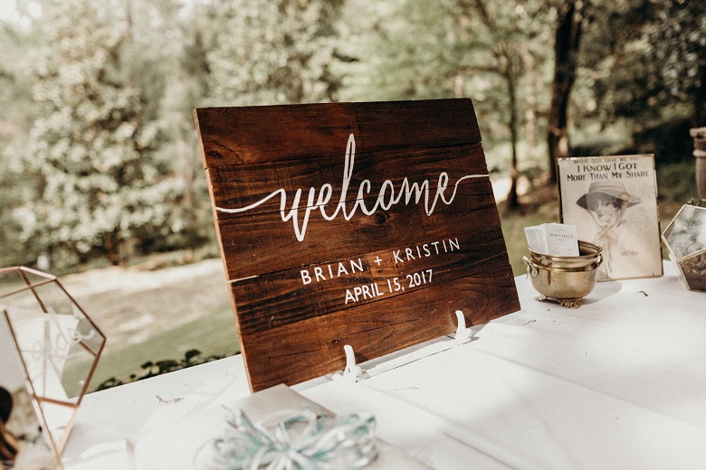 wooden handwritten wedding welcome sign