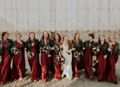 Bride and bridesmaids in red dress and leather jackets