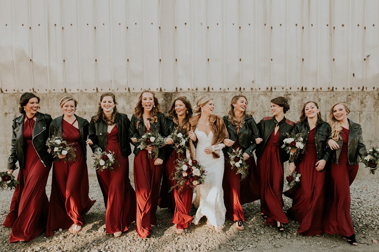 Bride and bridesmaids in red dress and leather jackets
