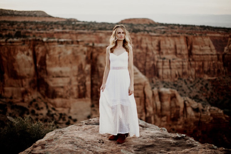 woman in minimalist wedding dress and loose hairdo