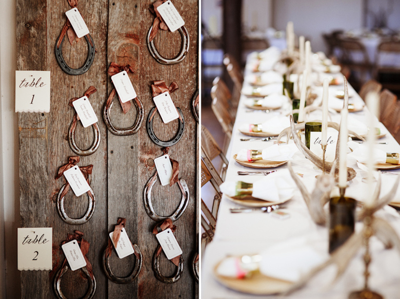 horseshoe wedding placement cards nailed to a wooden wall 