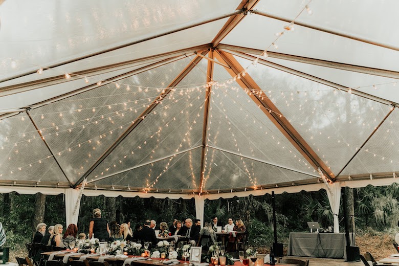 garden wedding clear tent with hanging light strings
