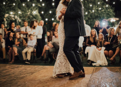 bride and groom's first dance on a wooden platform