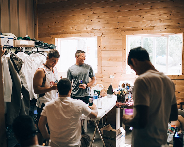 groomsmen getting dressed for the big day, indoors wood cabin setting