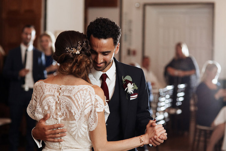 bride and groom dancing at an indoor wedding