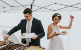 bride and groom eat food catering at wedding
