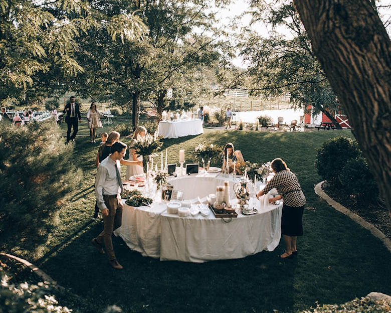 guests eating food at backyard wedding