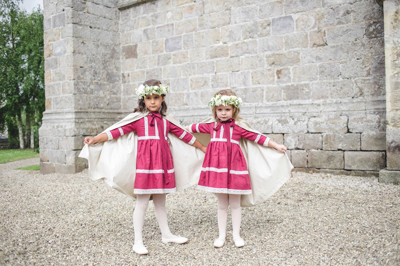 flower girls in pink dresses and capes