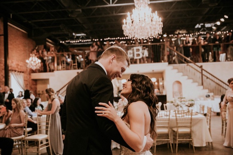 bride and groom dancing happily at their wedding