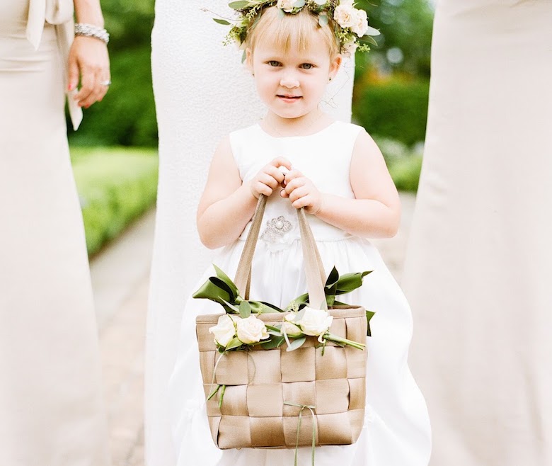 flower girl carrying a personalized purse at wedding