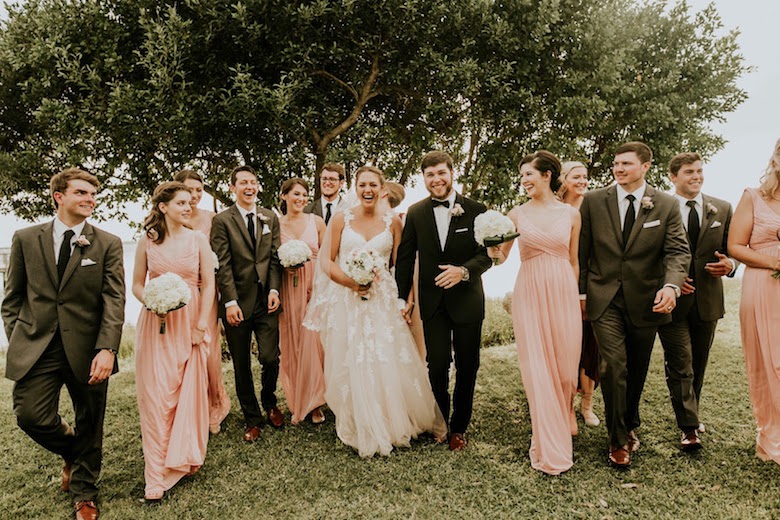 bride and groom with bridesmaids and groomsmen in spring wedding
