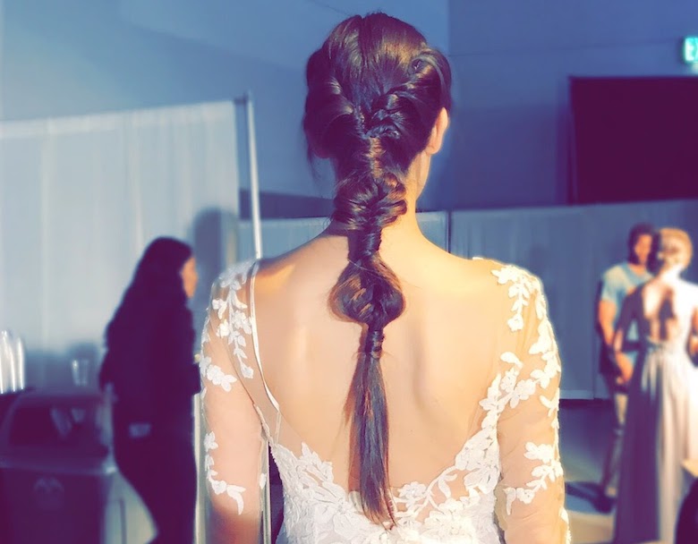 bride wearing a unique fishtail braid 