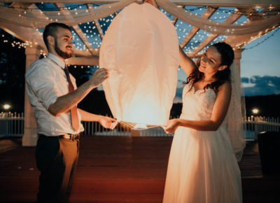 bride and groom with paper lantern for whimsical wedding