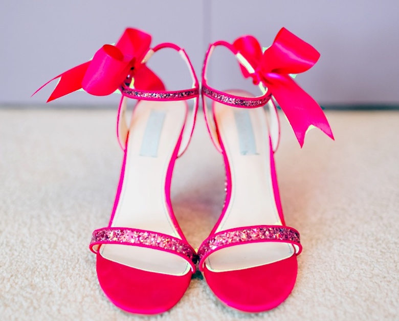 bright pink statement wedding shoes with bows for bride