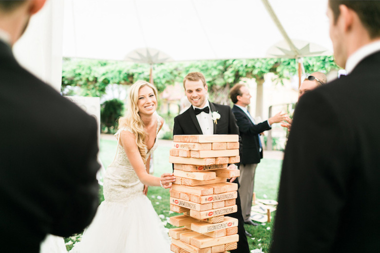 bride and groom playing games at their casual wedding