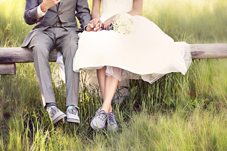 bride and groom wearing sneakers at their casual wedding