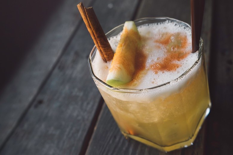 spiced whiskey sour with green apple and cinnamon