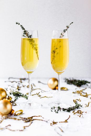 winter champagne with christmas decorations and garnish