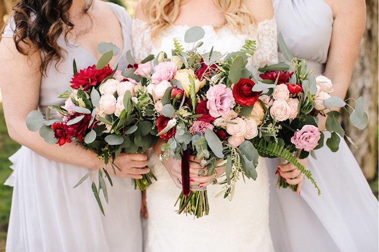 bride and bridesmaids with wedding bouquet